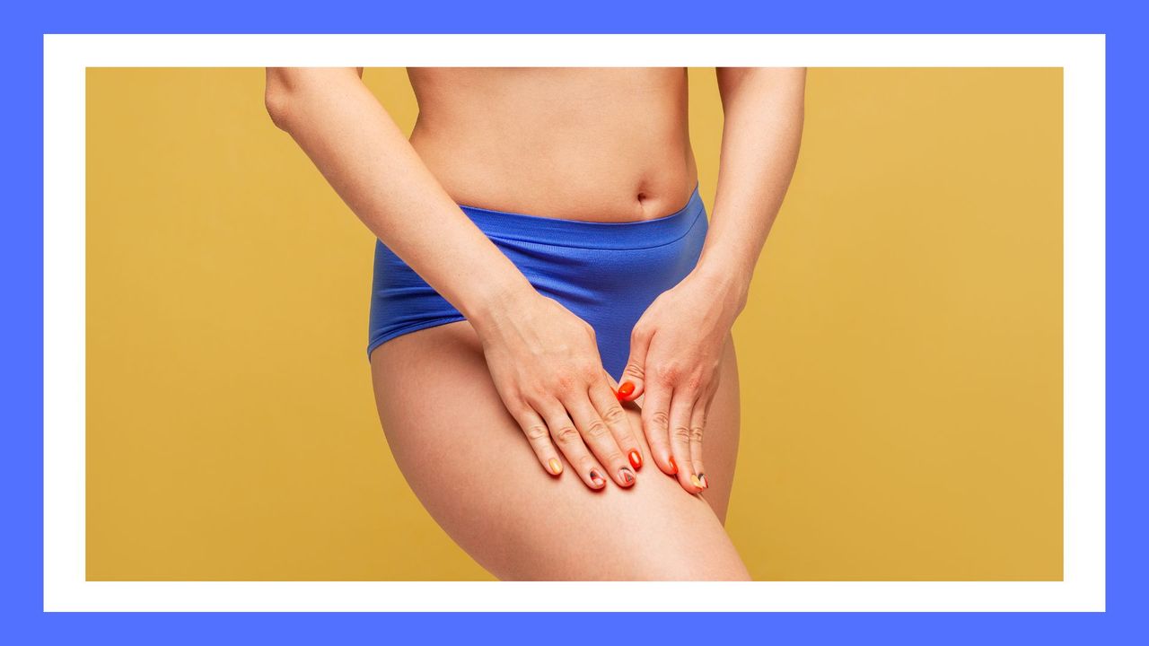 women&#039;s lower half of body in blue undies on a yellow background