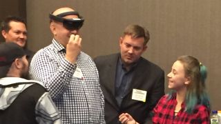 Superintendent tries out VR goggles.