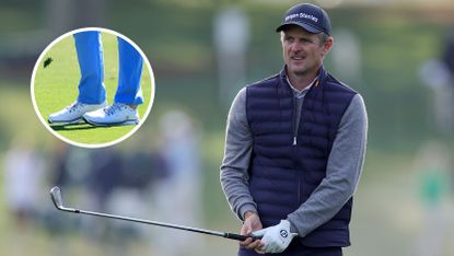 Justin Rose hits an iron shot into the green