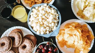 Collection of ultra-processed foods, including popcorn, fizzy drinks, crisps and pastries