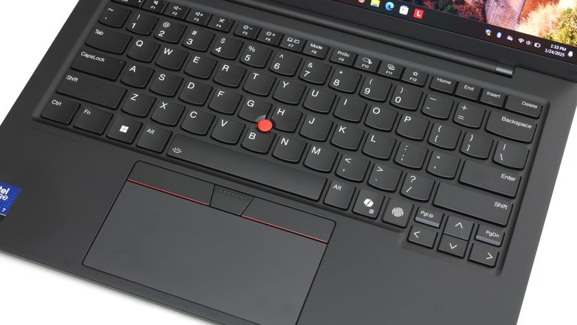 A close up of a black laptop keyboard and trackpad