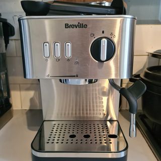 Silver Breville Espresso Coffee Machine on white a counter-top