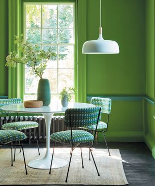 Little Greene green walls in a colorful dining room