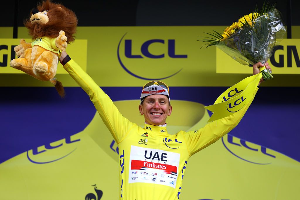 TIGNES FRANCE JULY 04 Tadej Pogaar of Slovenia and UAETeam Emirates yellow leader jersey celebrates at podium during the 108th Tour de France 2021 Stage 9 a 1449km stage from Cluses to Tignes Monte de Tignes 2107m Lion Mascot LeTour TDF2021 on July 04 2021 in Tignes France Photo by Tim de WaeleGetty Images