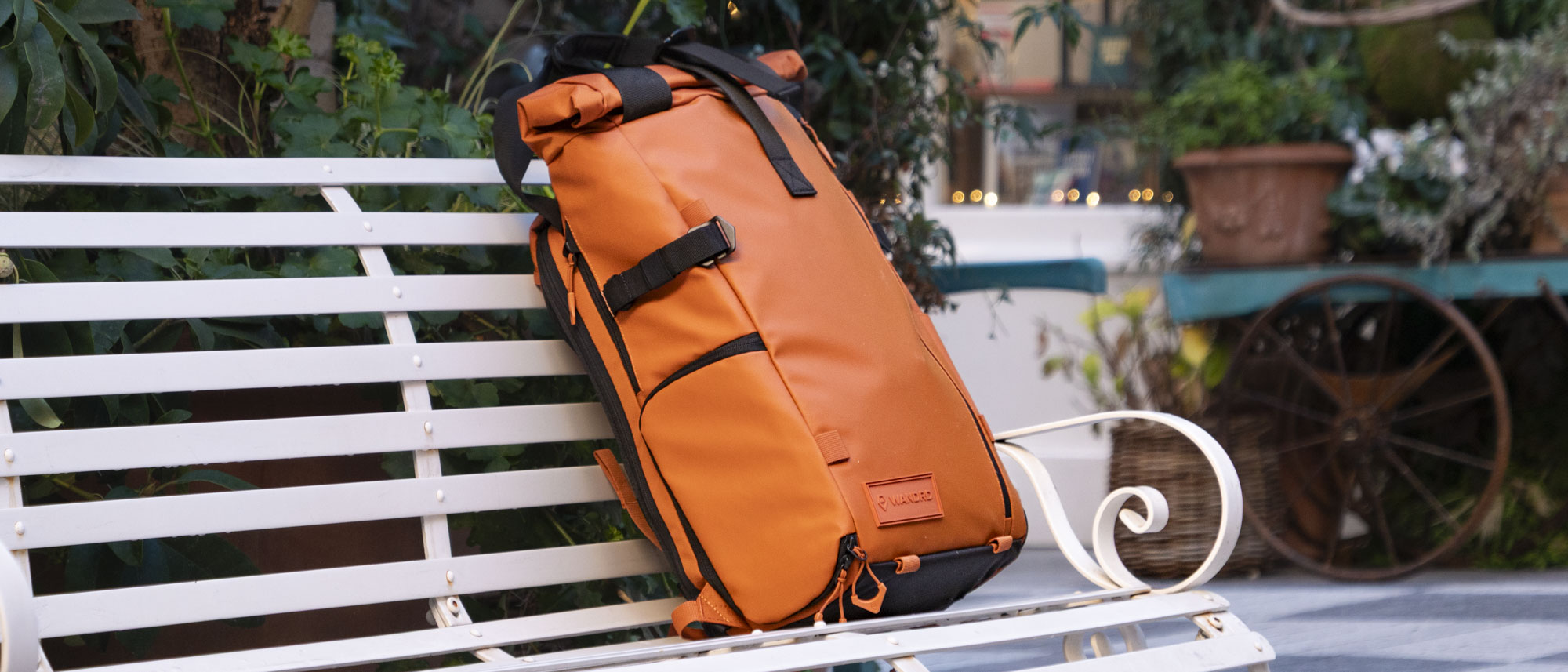 Wandrd PRVKE V4 bag on a white metal bench 