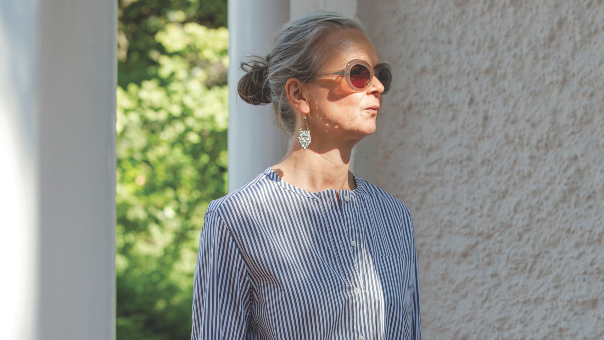 Fashion expert Alyson Walsh wears grey oval sunglasses