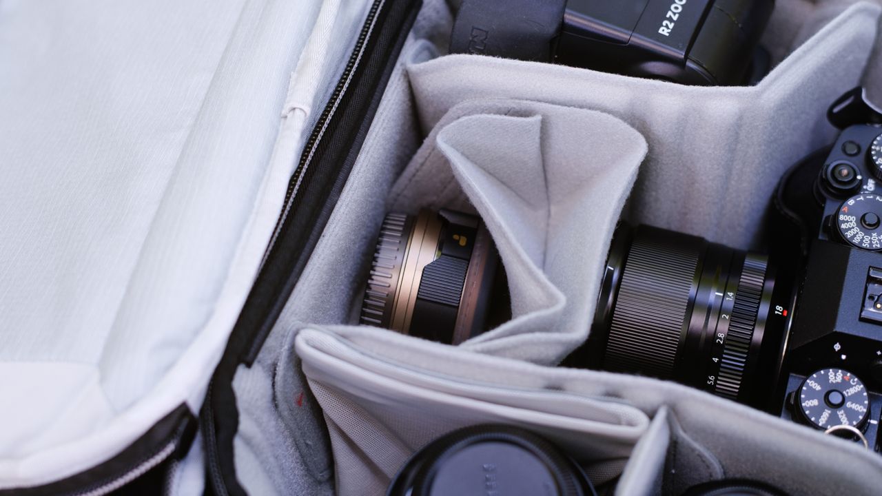 The Peak Design Travel Backpack 20L in use by a photographer