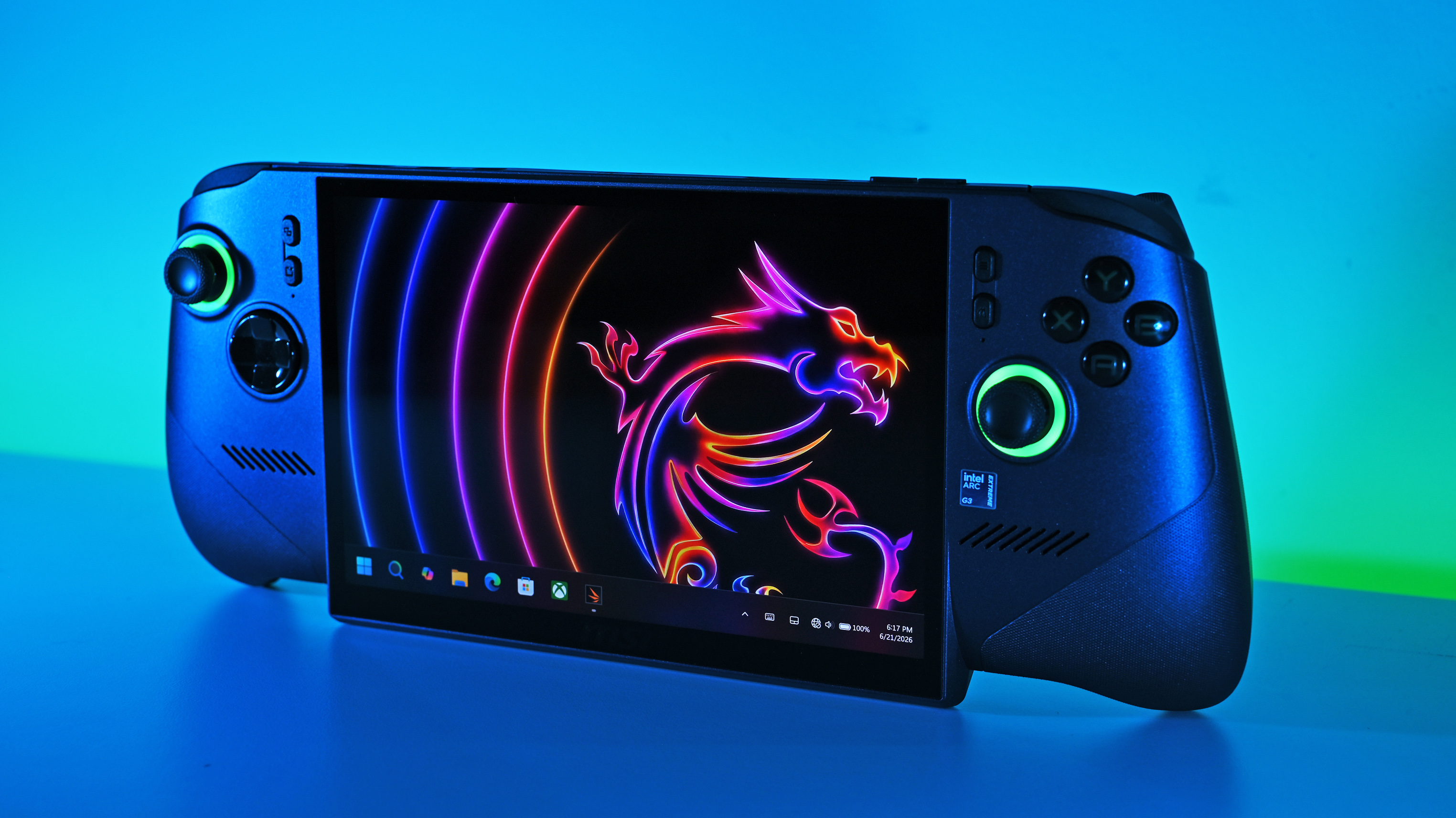 Three-quarter view of the MSI Claw 8 EX AI+ standing on a surface under cool blue and green ambient studio lighting, showing the Windows 11 desktop.