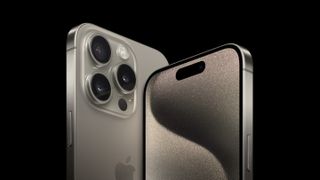 iPhone 15 Pro and Pro Max seen from the front and behind standing vertically against a black background