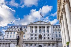 Stunning view of the Bank of England grand neoclassical facade with columns under a vibrant blue sky