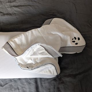 The Panda Hybrid Bamboo Pillow being tested on a grey linen duvet cover