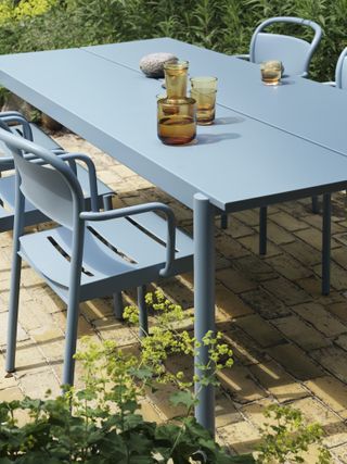 A blue metal outdoor patio set