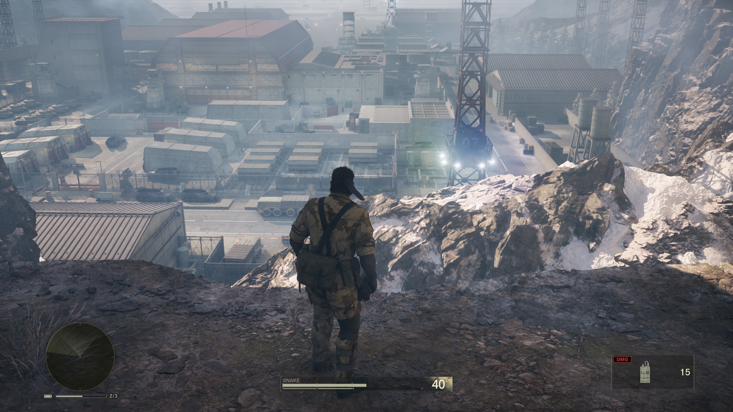 Snake looks out across the Grozynj Grad base in Metal Gear Solid Delta: Snake Eater