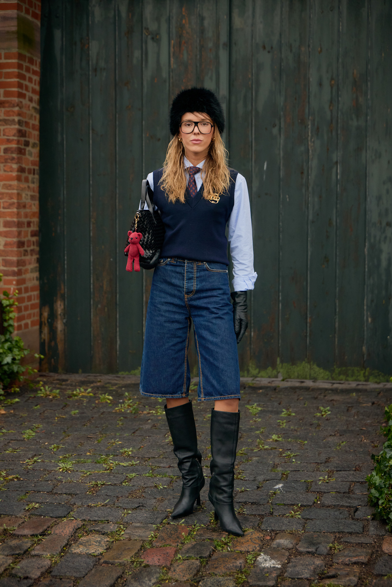 woman wearing a polo vest and a button down
