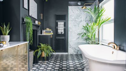 White tiled bathroom, bathtub, shelving, artwork