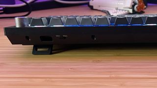 Top of Corsair K65 Plus Wireless showing PC and Mac switch