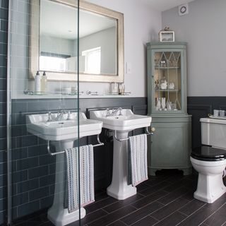 white ceramic sink beside white ceramic toilet bowl