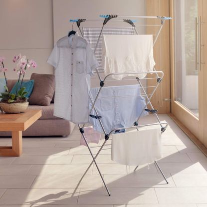 Clothes airer drying clothes in living room