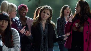 anna kendrick looks impressed during a sing off in a still from the movie Pitch Perfect