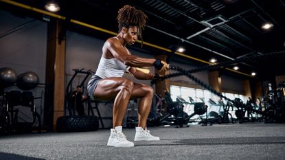 Does muscle weigh more than fat: A woman exercising 