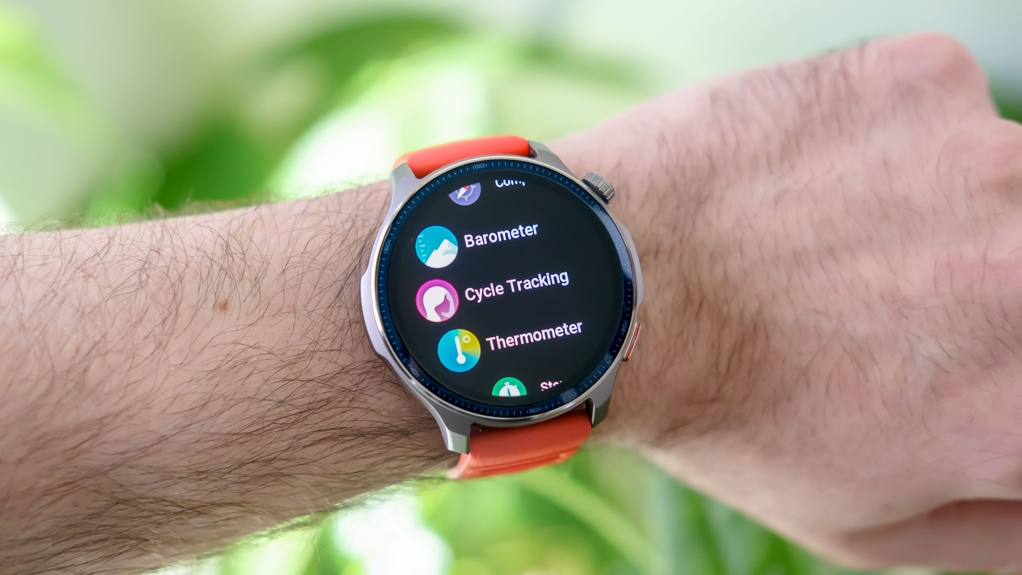 Close-up of the Amazfit Balance 2 smartwatch on an orange rubber strap