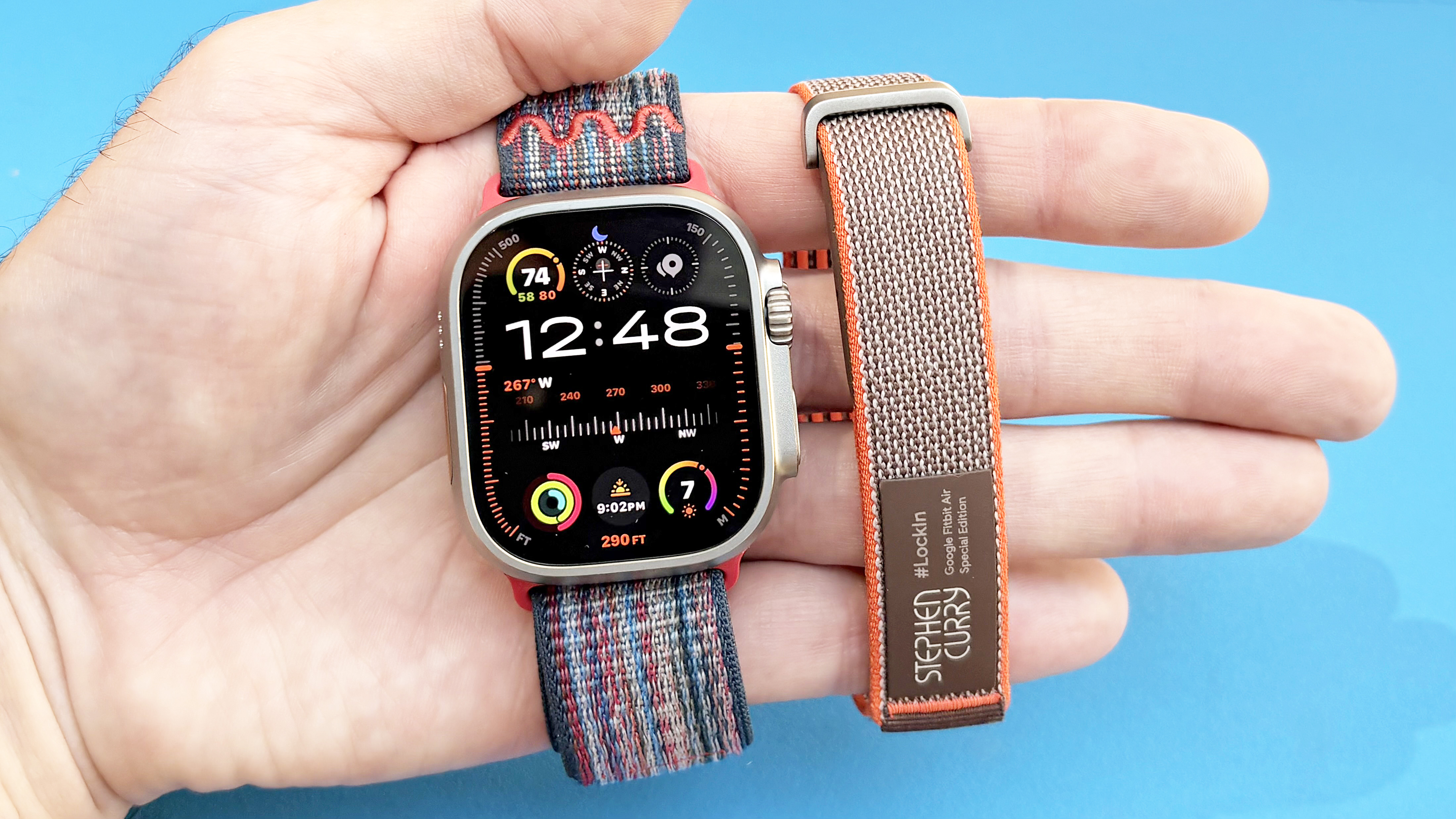 Close-up of the Apple Watch Ultra 3 and Fitbit Air