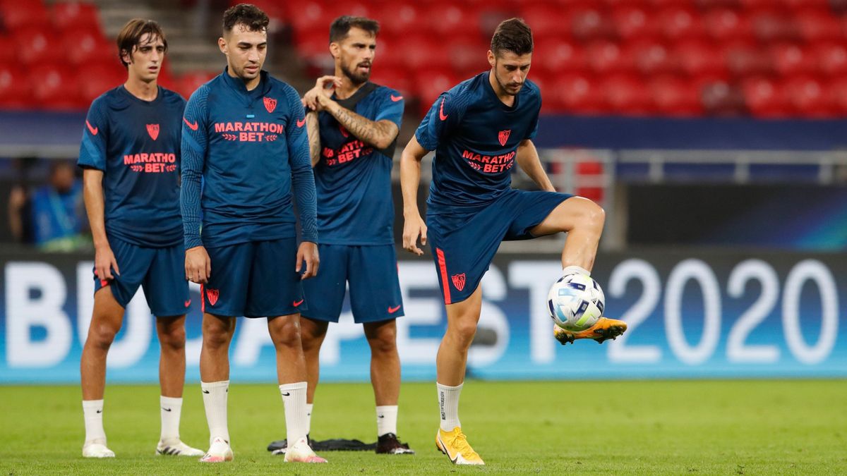 Sevilla players warm up in a training session for the 2020 UEFA Super Cup match against Bayern Munich.