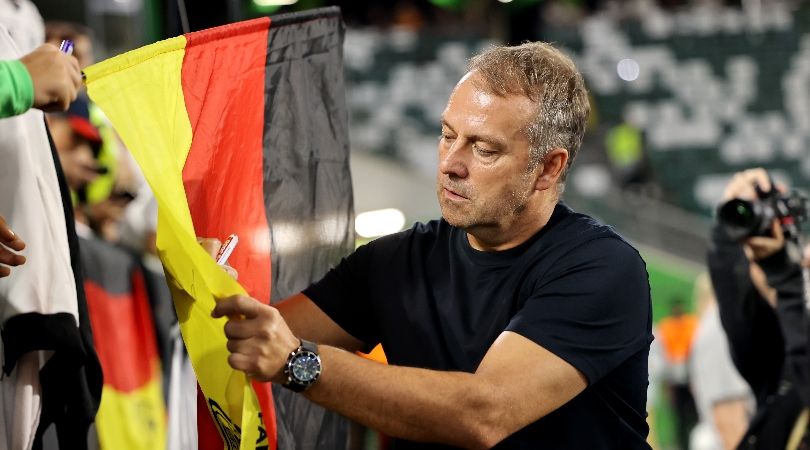 Germany coach Hansi Flick signs autographs after his side&#039;s 4-1 loss to Japan in September 2023.