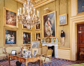 Large room with many framed paintings