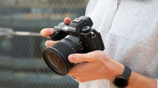 Nikon Z6 III camera held in a pair of hands