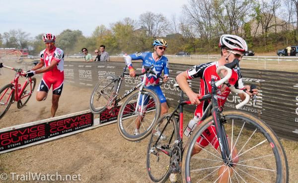 Elite men take on the barriers.