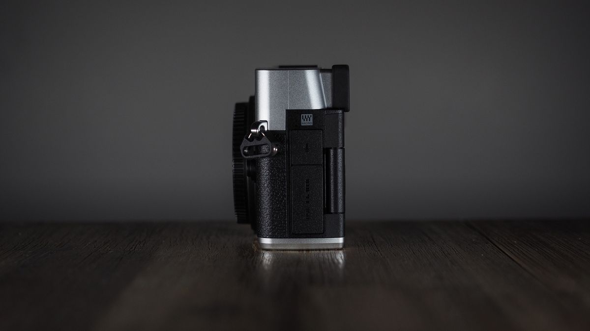 OM System OM-3 on a wooden surface
