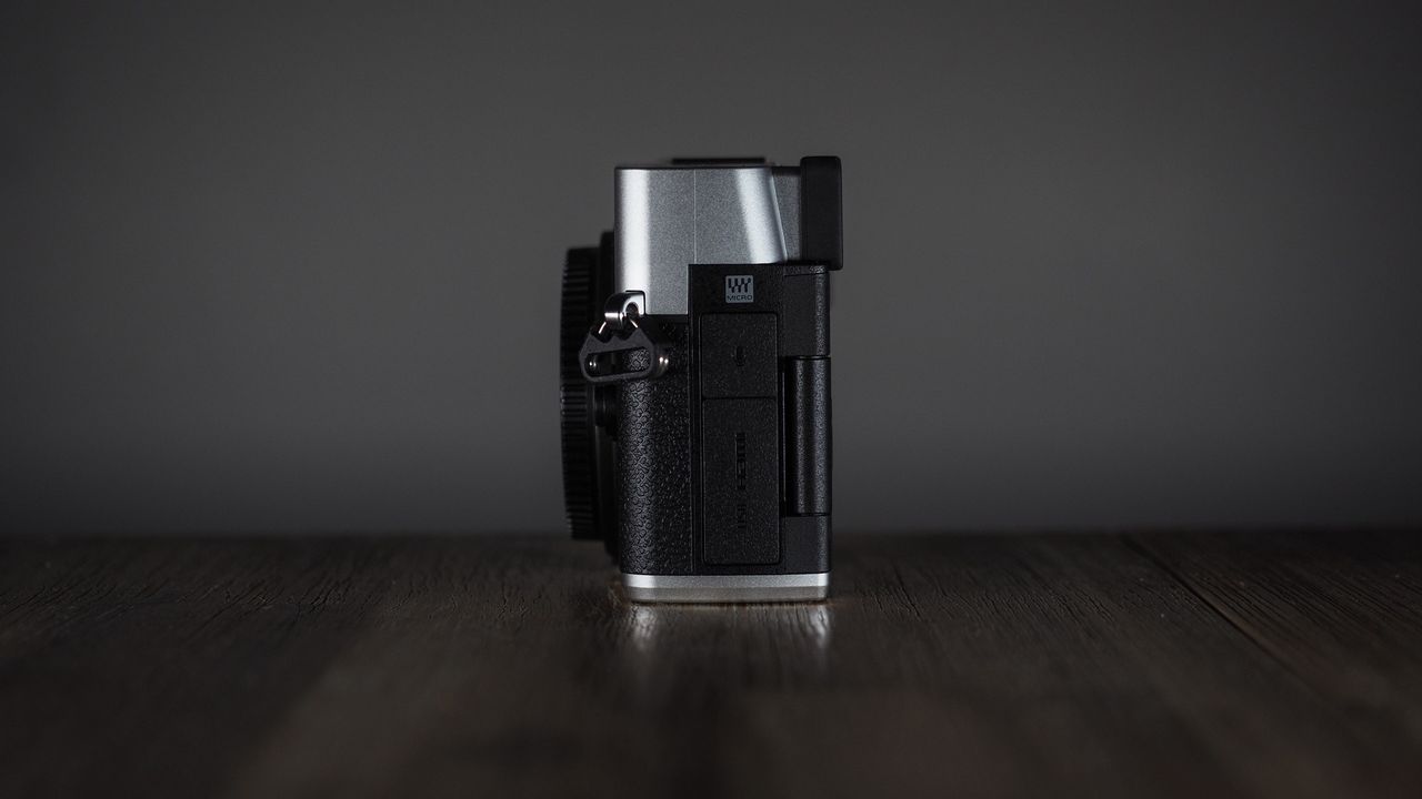 OM System OM-3 on a wooden surface