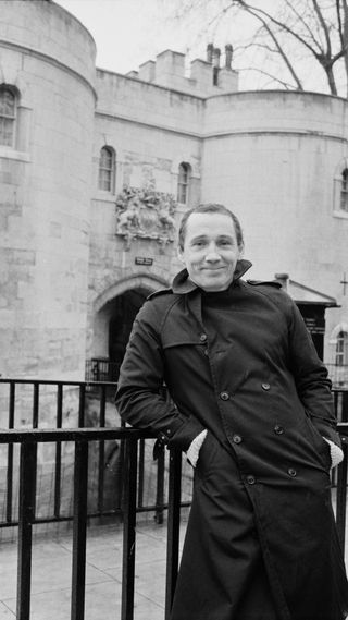 Michael Fagan, the man who broke into Buckingham Palace, posing in front of the Tower of London
