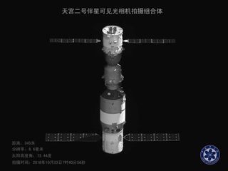A view of Tiangong-2 (below) docked with Shenzhou-11 imaged by Banxing-2.