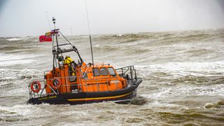Hasting RNLI Lifeboat out at sea on choppy waters