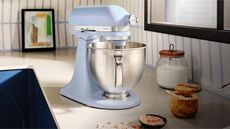 KitchenAid Artisan Stand Mixer in Blue Salt, the KitchenAid Color of the Year 2024, on a kitchen counter.