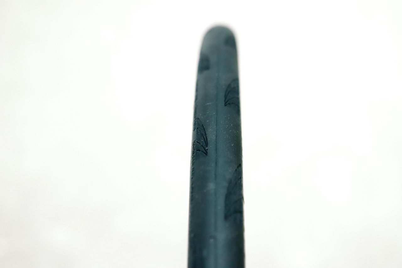 a close up of a black road bike tyre