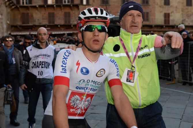 Strade Bianche winner Michal Kwiatkowski makes his way to the podium in Siena
