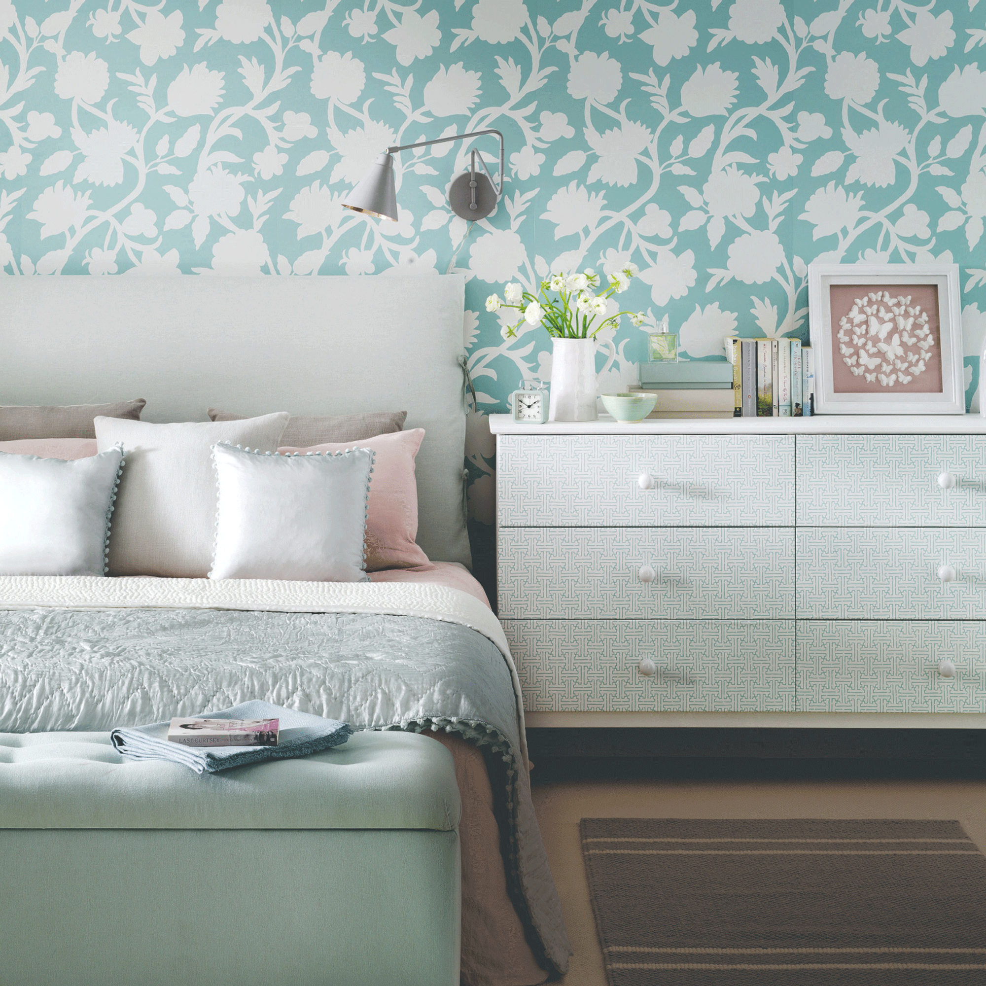 Small bedroom with blue wallpaper