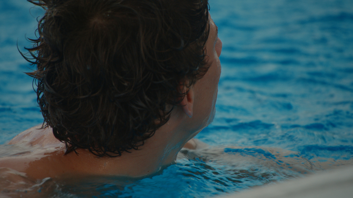 male diver swimming after dive
