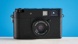 A black Fujifilm X half camera
