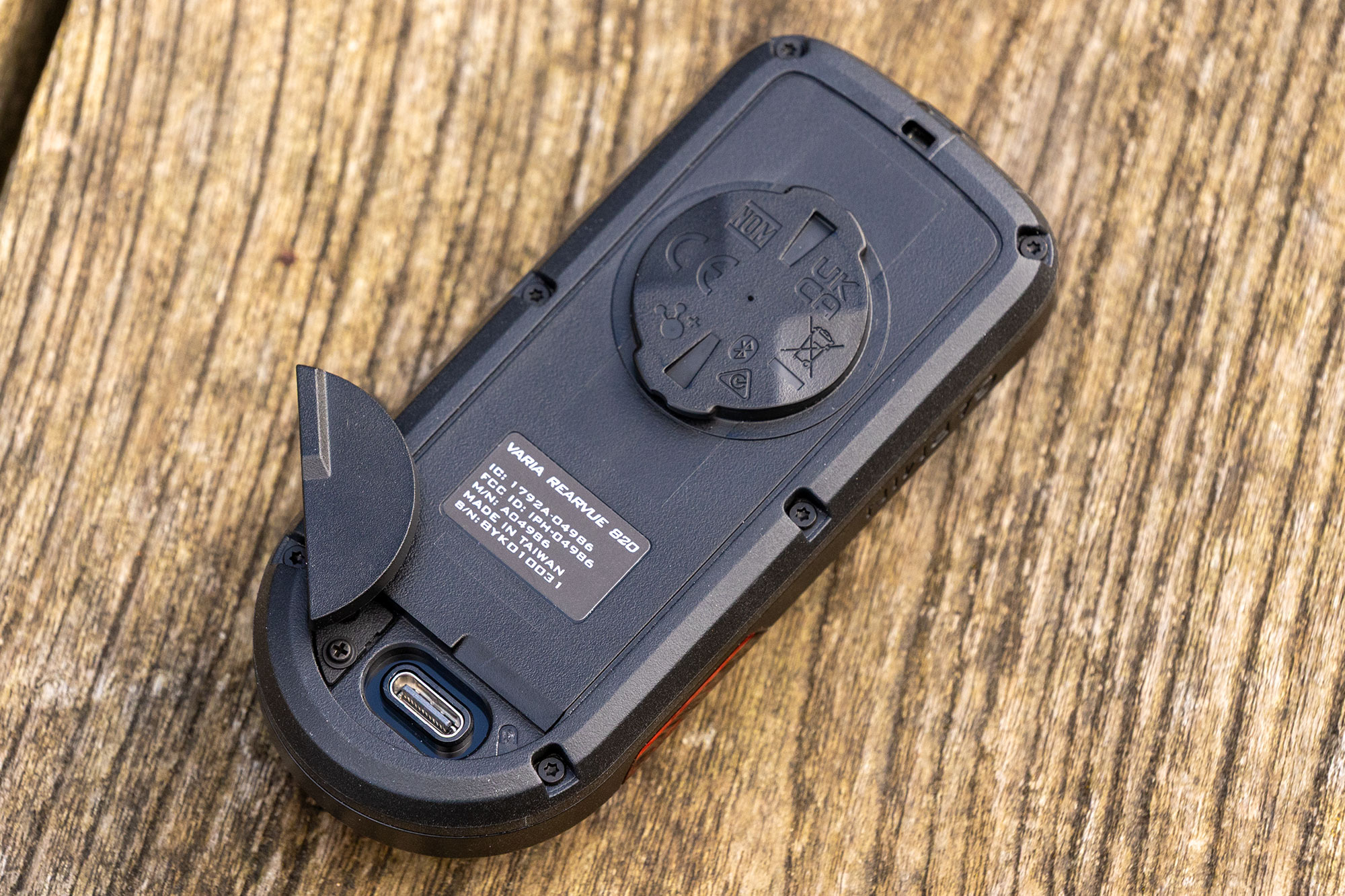 Photo of the back of the Garmin Varia RearVue 820, with weatherproof cover for USB-C port open