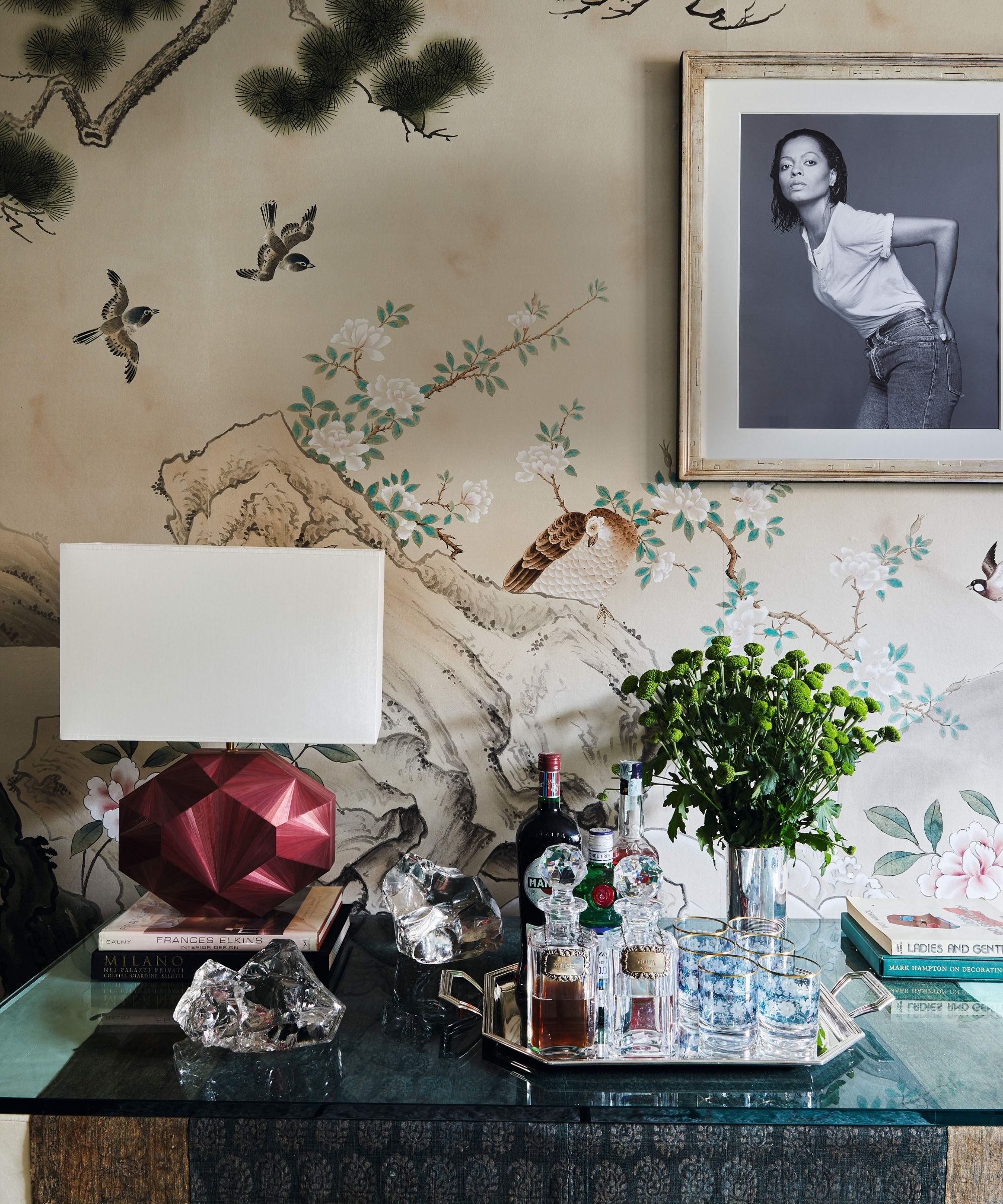 living room in a new york apartment with mural wallpaper and vintage decor