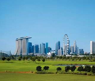 A view of the singapore skyline from the Marina Bay Golf Course.