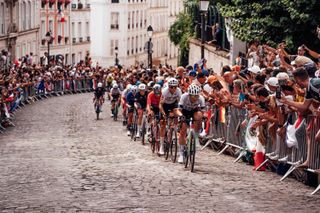 Paris, France - Women’s Road Race - Kristen Faulkner (USA), Margarita Victoria Garcia (Spain), Blanka Vas (Hungary) climbs the crowd lined street of the Côte De La Butte Montmartre