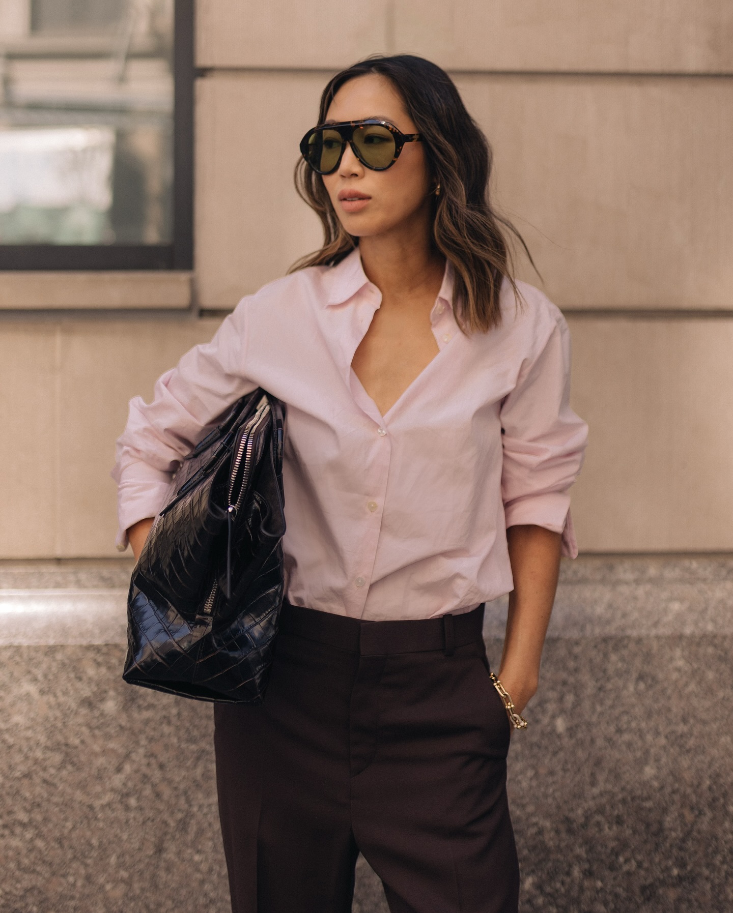 Aime Song with brown hair with blonde highlights