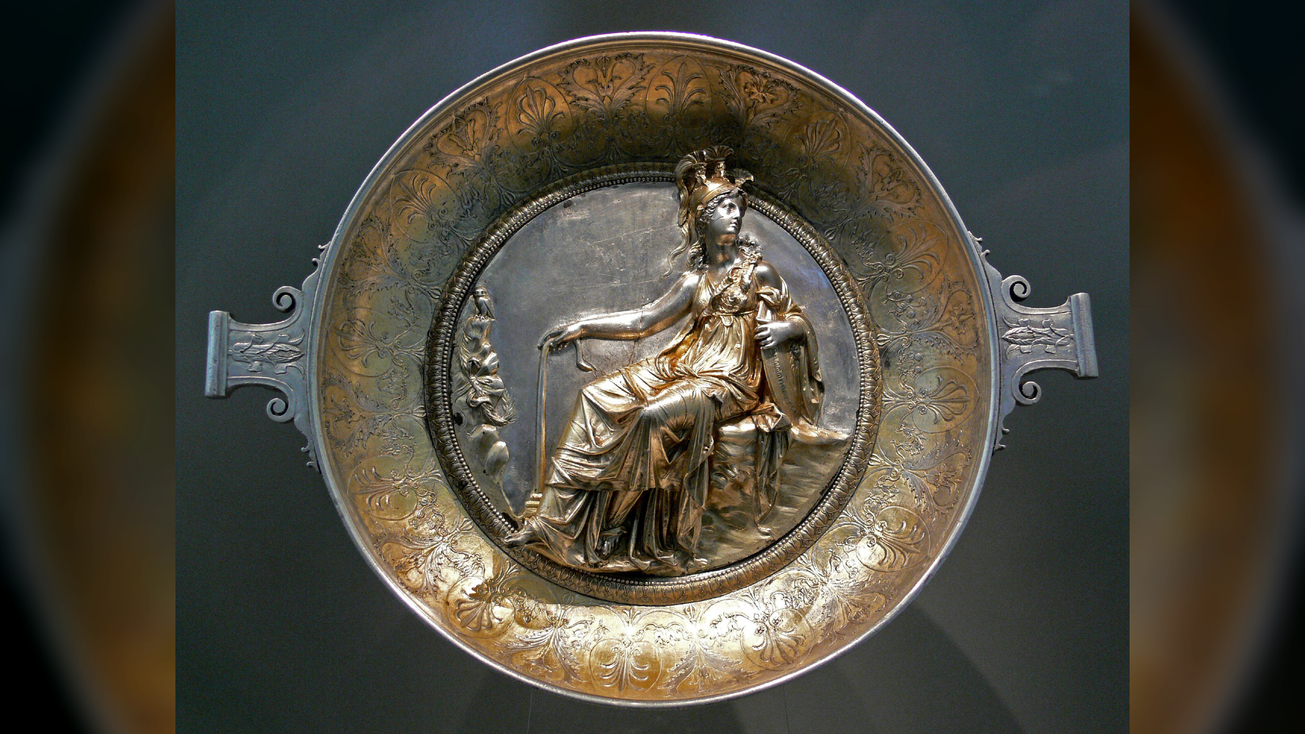 gold and silver bowl with a seated Athena in the middle