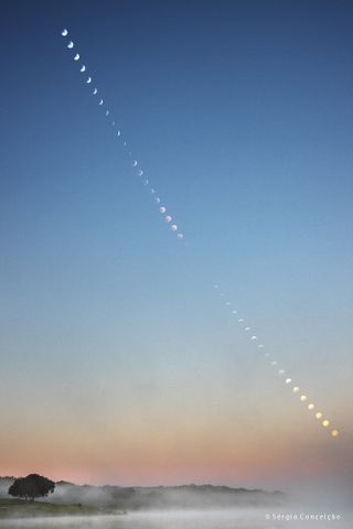 Astrophotograper Sérgio Conceição created this composite image of the phases of the lunar eclipse as the moon was setting below the horizon as seen from the village of Campinho, Portugal on the morning of Jan. 21, 2019.
