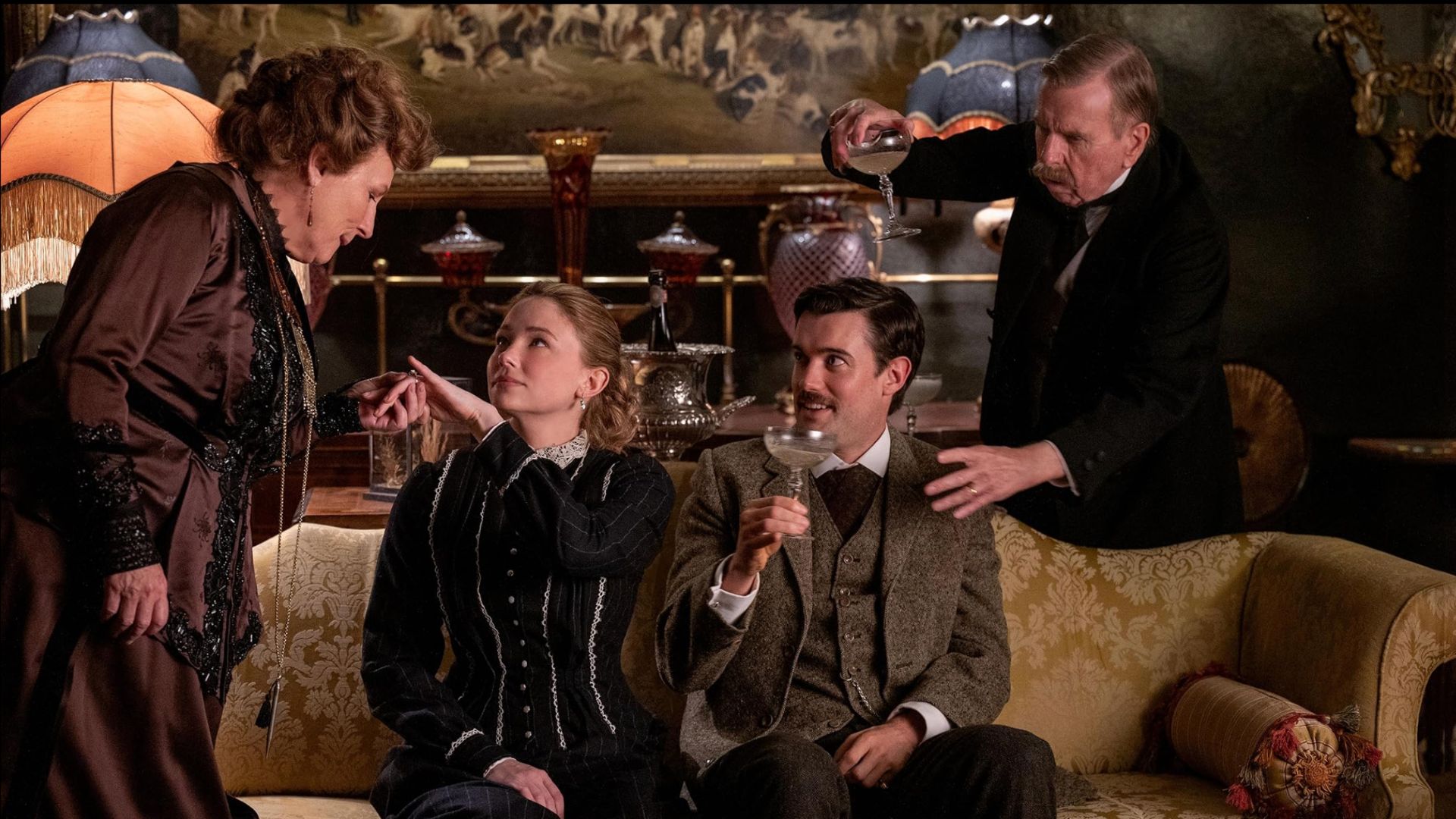 a production image from the film showing two fo the leads &ndash; Katharine Hilbery and William Rodney on a sofa 